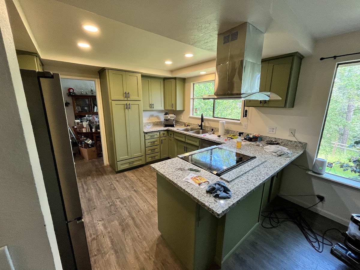 Kitchen cabinet refresh with green painted cabinetry by Gibbons Construction