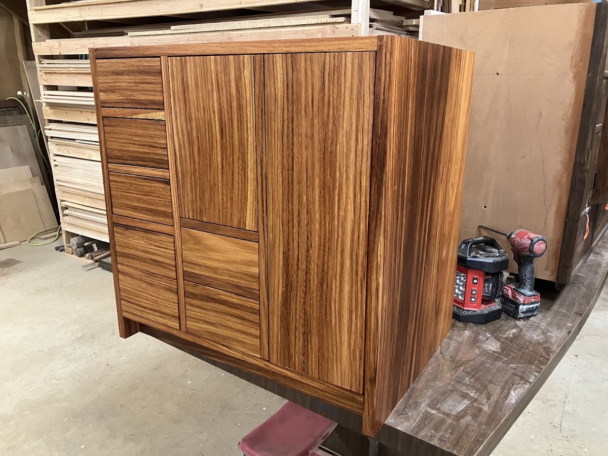 Custom built zebra wood cabinet made by Gibbons Construction